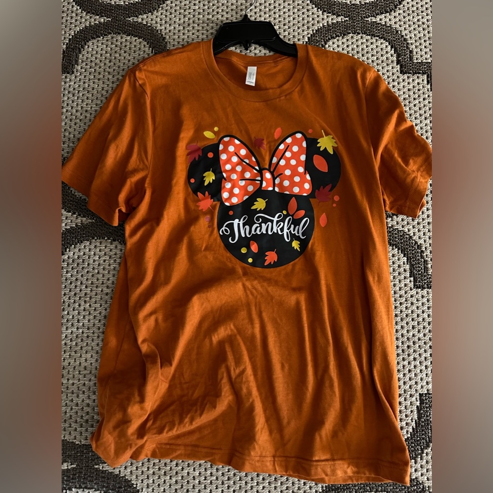 Orange fall Disney shirt.